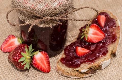 Fresh made strawberry jam on bread Stock Photos
