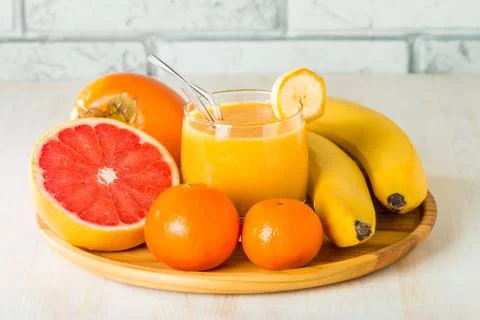 Fresh made yellow smoothie Stock Photos