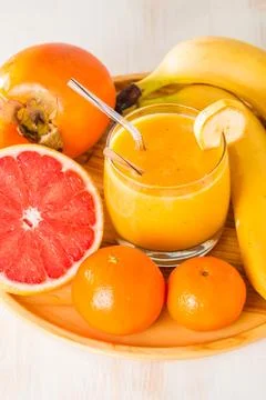 Fresh made yellow smoothie Stock Photos