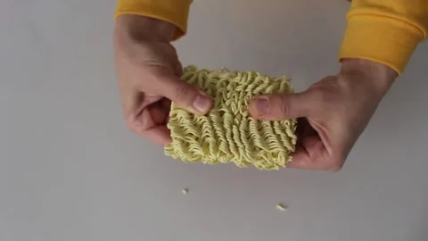Fresh Maggi Breaking with hands Stock Footage 270300556