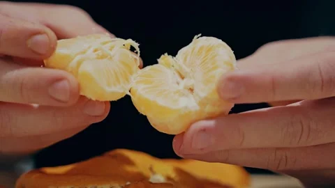 Fresh Mandarin Split Into Segments Showing Healthy Nutrition and Family Care 库存影片 340890338