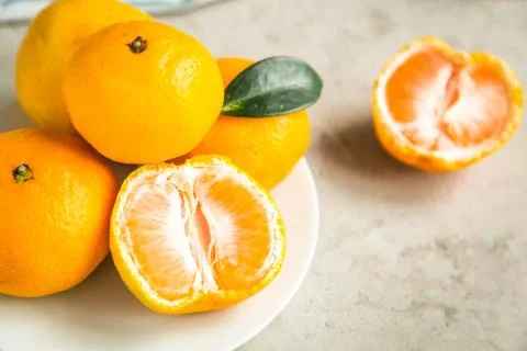 Fresh mandarin tangerines on table Stock Photos