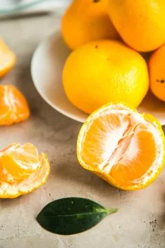 Fresh mandarin tangerines on table Stock Photos