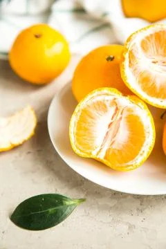Fresh mandarin tangerines on table Stock Photos
