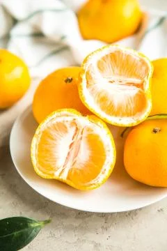 Fresh mandarin tangerines on table Stock Photos
