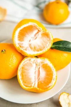 Fresh mandarin tangerines on table Stock Photos