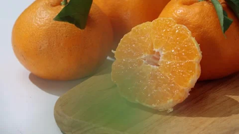 Fresh Mandarins and Slice Close Up Still Life 4K Stock Footage 340451954