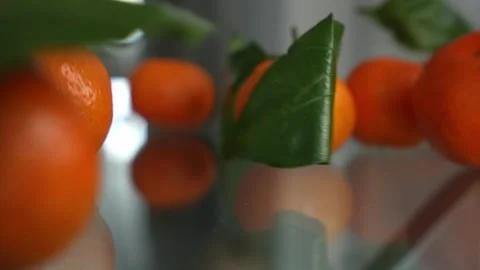 Fresh mandarins are poured onto the table Stock Footage 266751553
