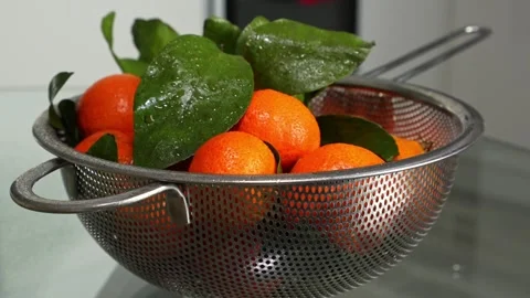 Fresh mandarins are poured onto the table Stock Footage 266751561
