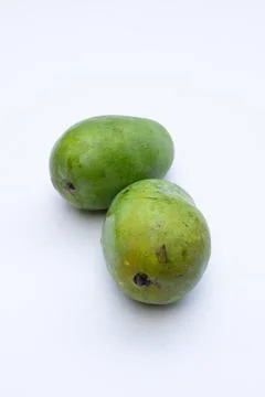 Fresh mango fruit on a white background, highlighting its vibrant yellow co.. Stock Photos