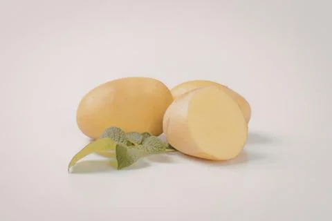 Fresh mango halves with mint leaf Stock Photos
