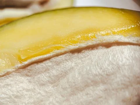 Fresh mango macro. The fruit pit is visible in detail Stock Photos
