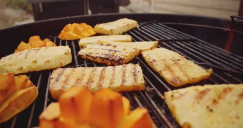 Fresh mango, pineapple slices and a wheel of brie cheese in a ramekin being Stock-Footage 159607992
