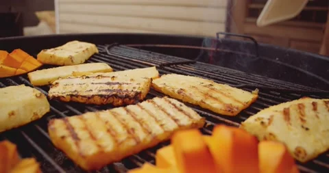 Fresh mango, pineapple slices and a wheel of brie cheese in a ramekin being Stock Footage 159608022