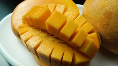 Fresh Mango Sliced Halved and Whole Tropical Fruit Display Stock Footage 310973535