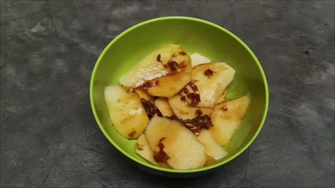 Fresh mango sliced thinly with sweet, sour, and spicy palm sugar sauce Stock Footage 323579480