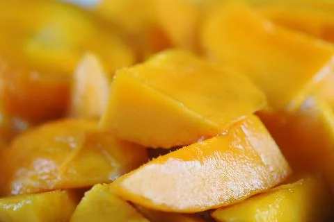 Fresh mango slices on a plate ready for tasting or serving at a gathering Stock Photos