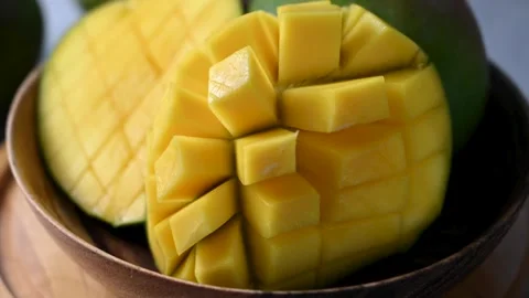 Fresh mango slow motion. Delicious, juicy sliced mango fruit. Stock Footage 247558615