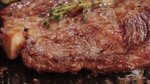 Fresh marbled beef with pepper, salt and rosemary close-up macro. Cooking juicy Stock Footage 266960429