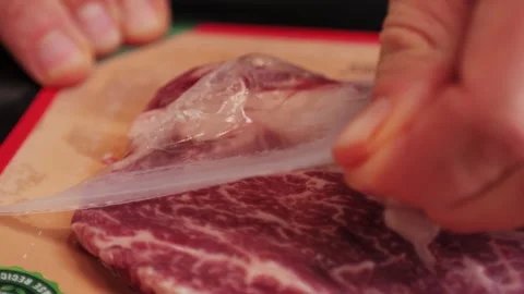 Fresh marbled beef with pepper, salt and rosemary close-up macro. Preparation to Stock Footage 267021492
