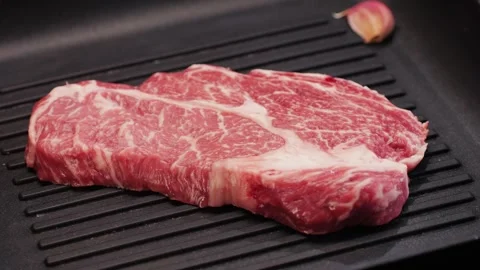 Fresh marbled beef with pepper, salt and rosemary close-up macro. Preparation to Stock Footage 270099073