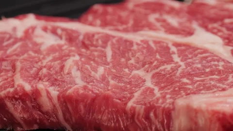 Fresh marbled beef with pepper, salt and rosemary close-up macro. Preparation to Video stock 270484581