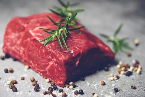 Fresh meat beef sliced on black background - Raw beef steak with herb and spi Foto stock