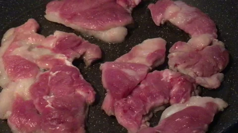 Fresh meat frying in the pan Stock Footage 199120423