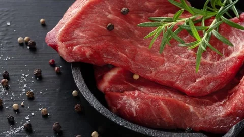 Fresh meat with ingredients for cooking on dark table. Stock Footage 309542641