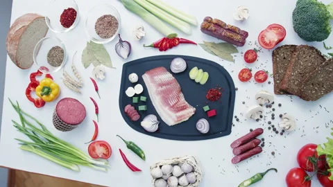 Fresh meat surrounded by vegetables for homemade soup Stock Footage 232394623