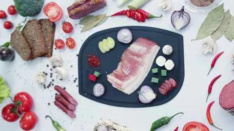 Fresh meat with vegetables on cutting board in kitchen Stock Footage 232520564
