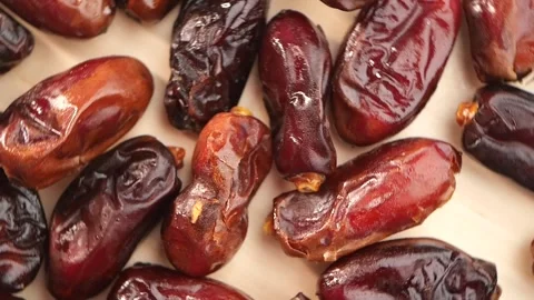 Fresh Medjool Dates Displayed Beautifully on a Light Aesthetic Background Stock Footage 299498952