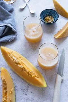 Fresh melon juice on the table, preparing melon  juice by raw ripe biological Stock Photos
