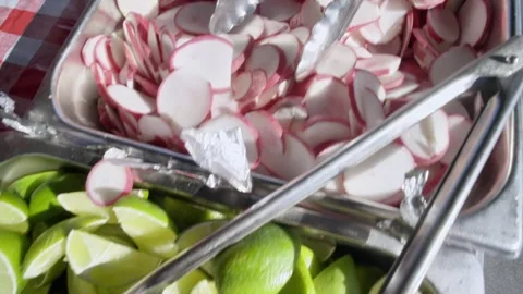 Fresh Mexican Taco Condiments | Lime, Pickled Red Onions, and Radishes Close-Up Stock-Footage 338299348