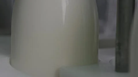 Fresh milk bottle entering processing machine in dairy factory 스톡 일러스트