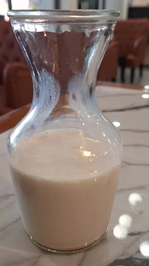 Fresh Milk Bottle on Marble Table Stock Footage 337934255