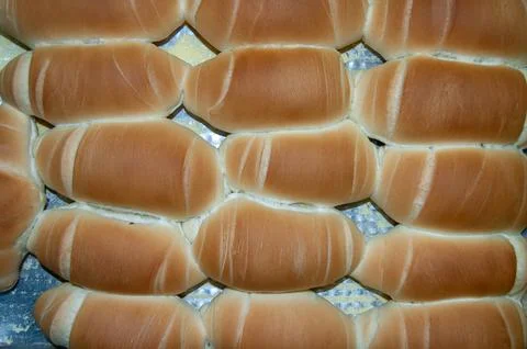 Fresh milk bread rolls aligned Stock Photos