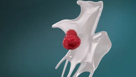 Fresh milk splash falling in slow motion with raspberry Stock Footage 253708671