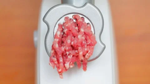 Fresh minced meat comes out of the grinder Stock Footage 81676451