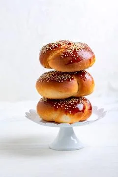  Fresh mini challah bread. Stack of sweet round mini challah bread with se... Stock-Fotos