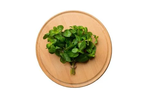 Fresh mint on Cutting board table isolated on white background, top view. Fla Stock Photos