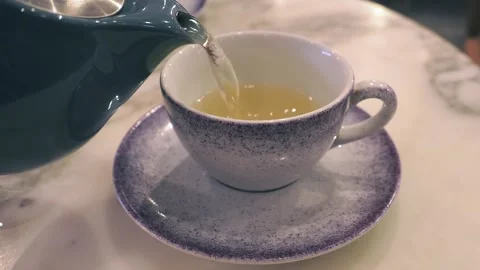 Fresh Mint Tea Being Poured Into A Cup, London, UK Stock Footage 240443305