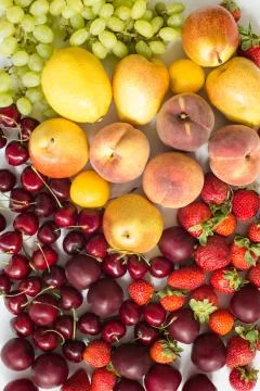 Fresh mixed fruits, berries background.Healthy eating.Love fruit, diet. Stock Photos