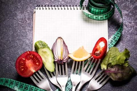 Fresh mixed vegetables on fork ,black background Stock Photos