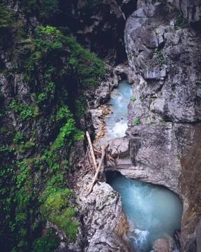 Fresh mountain stream flowing between rocks and forest 스톡 사진