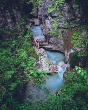 Fresh mountain stream flowing between rocks and forest 스톡 사진