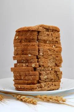 Fresh multi grain bread in a ceramic plate on white background Stock Photos