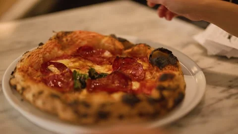 Fresh Neapolitan Pepperoni Pizza Served on Marble Table in Restaurant Stock Footage 337768949