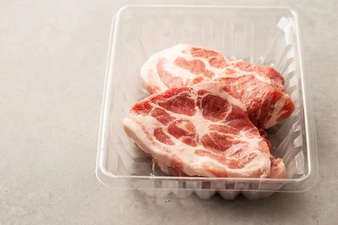 Fresh neck meat in packaging container Stock Photos