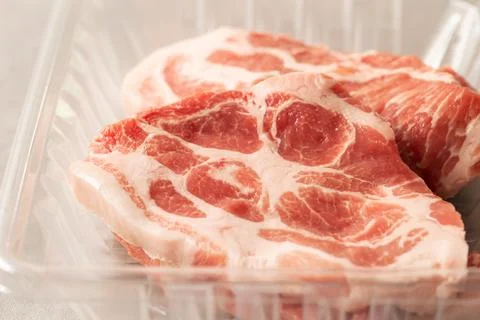 Fresh neck meat in packaging container Stock Photos